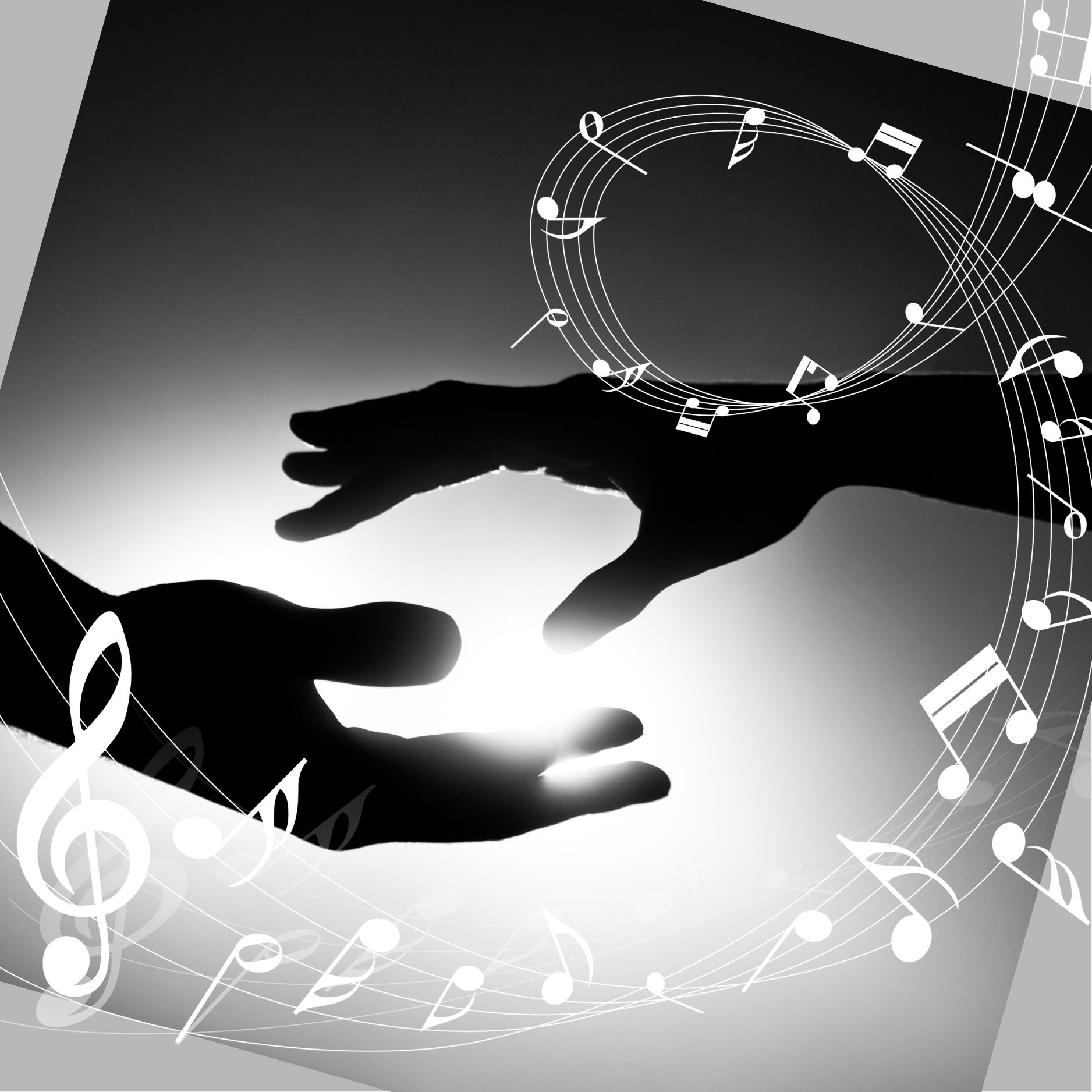 Two hands reaching out to one another in black and white with musical notes